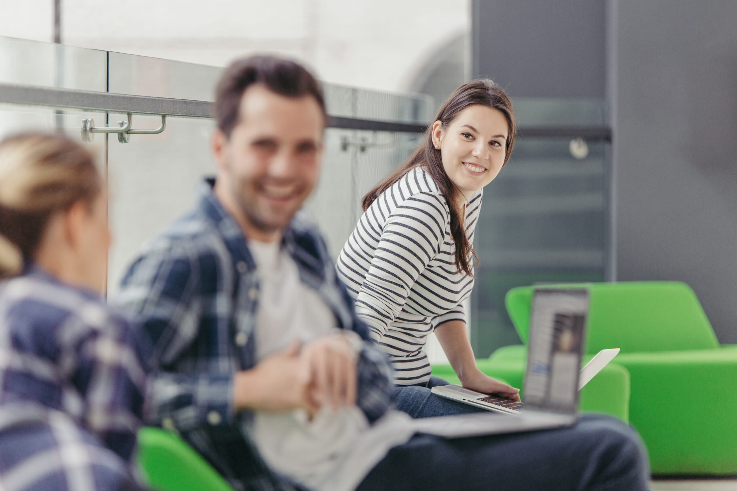 woman-looking-chatting-colleagues